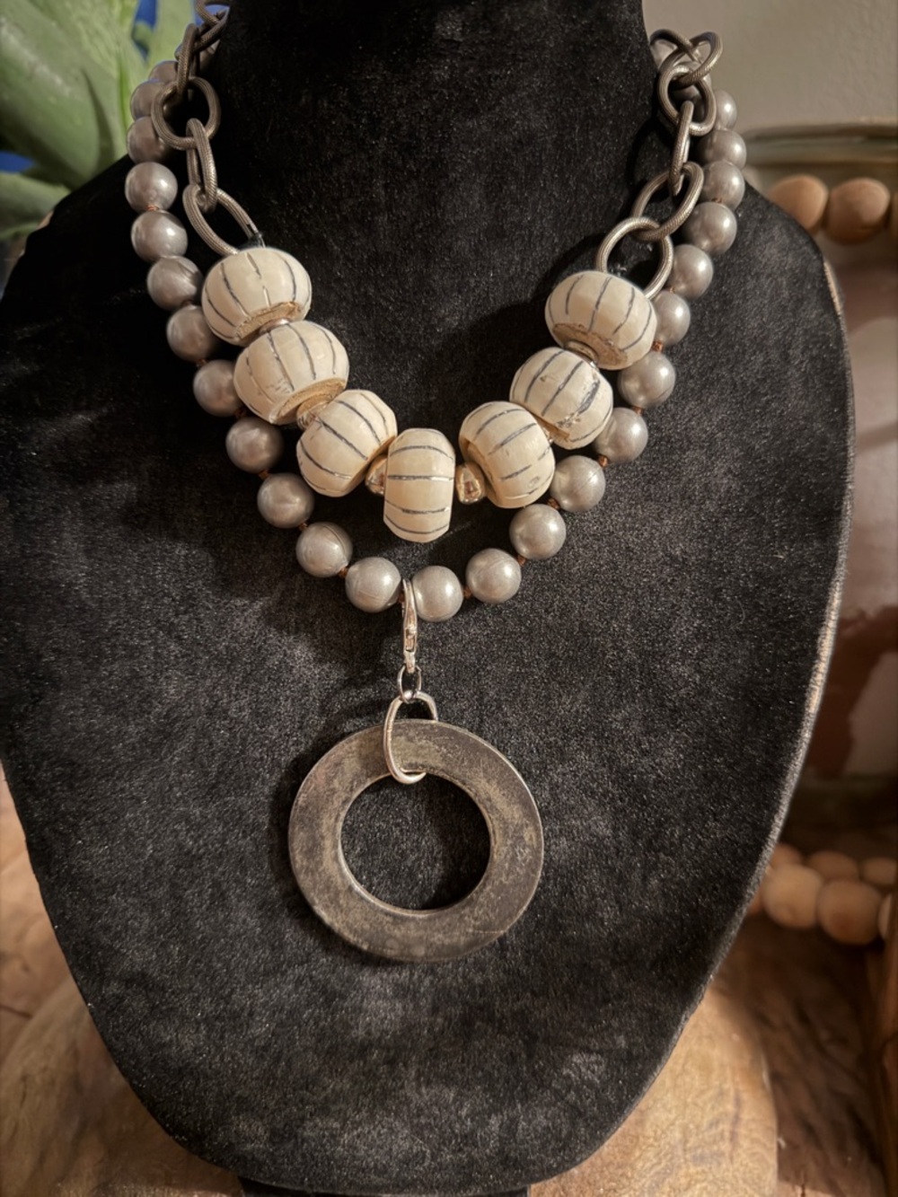 Carved bone with silver accents